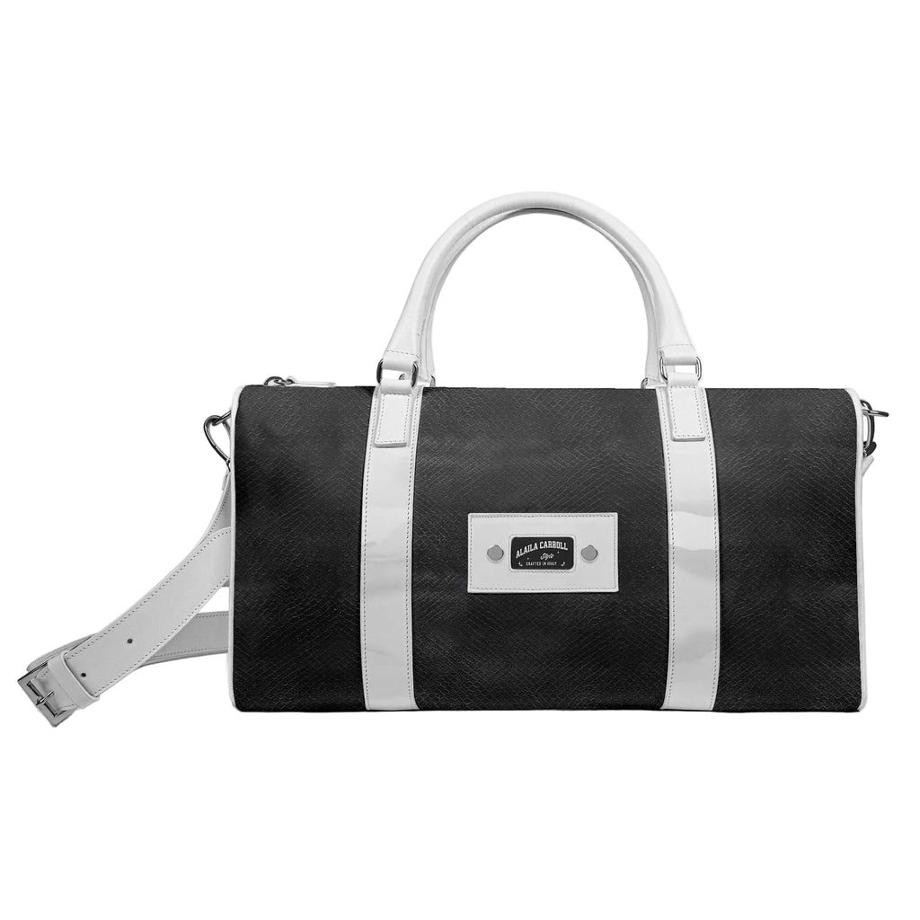Discover the Designer Luxe Travel Bag Black & White by Alaila Carroll Style. Handcrafted from premium materials with a spacious interior, Italian-inspired details, and timeless luxury for every journey.