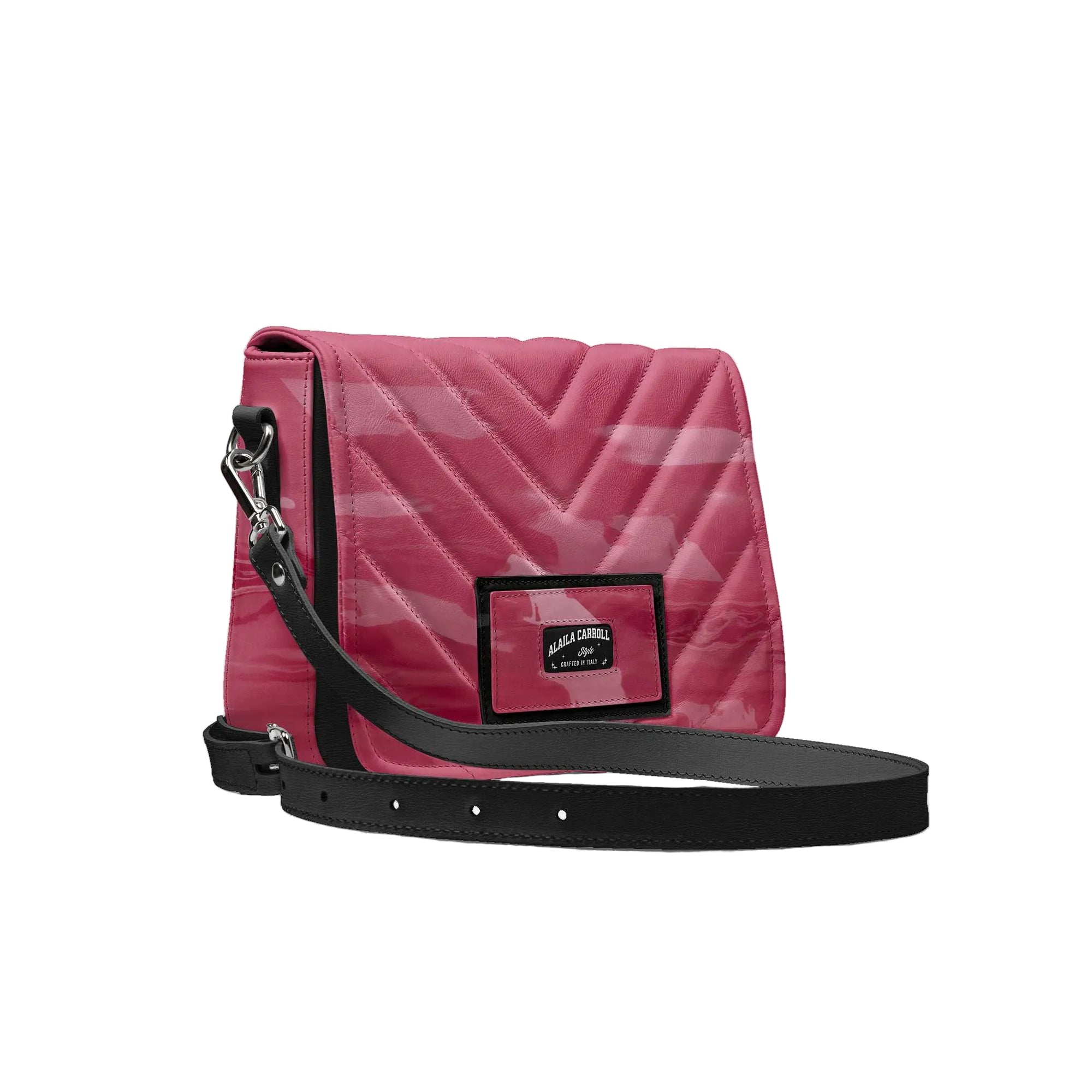 Luxury urban designer bag in varnish fuchsia and black with embossed logo

Fashion-urban crossbody bag with adjustable strap by Alaila Carroll Style

Structured luxury handbag with metallic details and front flap design