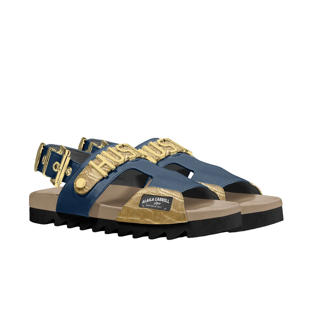 Luxury navy and gold sandal with metallic HUSTLE lettering, ankle buckle, and EVA sole for bold style and everyday comfort.

luxury sandals, hustle sandals, navy gold sandals, designer sandals