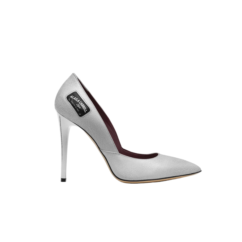 Elegant silver stiletto pump crafted in Italy from butter-soft materials. Features a sleek pointed toe, embossed panels, and a razor-sharp heel.

silver high heel pump
Italian stiletto heels
luxury women’s pumps
designer silver heels
pointed toe stilettos
classic evening heels
made in Italy heels
elegant high heel shoes