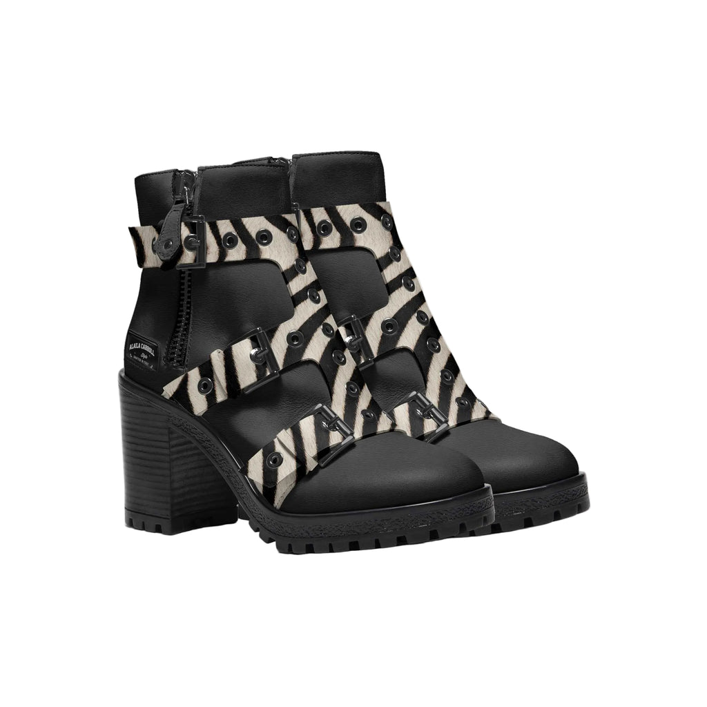 Shop the Triple Straps Boot in Black & Zebra. A bold monk-strap women’s boot with zip closure and striking zebra detailing for standout style.

Black and zebra triple strap boot

Luxury women’s monk strap boot

Zippered designer statement boot

Luxury women boots, designer ankle boots, triple strap boots, monk strap boot women, zebra print boots, bold fashion footwear
